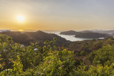 High point panoramic view from Christ of the Mercy statue standing on a cliff above the bay of San Juan del Sur in Nicaragua. clipart