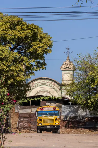 stock image Granada, Nicaragua - March 19, 2024: Public yellow bus with text Granada parked in Granada on the shores of Lake Nicaragua Cocibolca in Nicaragua Central America