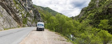 Touring whith camper along the beautiful road through George du Loup near Gourdon in south of France clipart