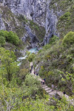 Georges du Verdon, France - May 9,2024: People hiking along the boardwalk into Gorges du Verdon, Grand Canyon Aiguines in Provence, France. clipart