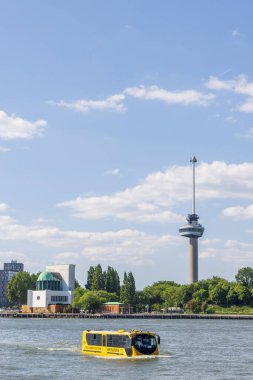 Rotterdam , The Netherlands - May 9, 2025: Skyline Rotterdam with famous Euromast tower, Maas tunnel building and water bus in port city Rotterdam in the Netherlands
