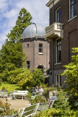 Leiden, The Netherlands - May 25, 2025: Historic observatory , museum and cafe in in Hortus botanicus in Leiden The Netherlands