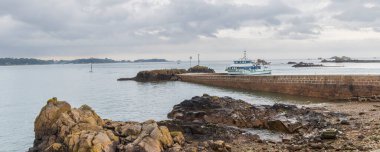 Tourist arriving in Arcouest from  little island Ile-de-Brehat  at the coast of Cotes-d'Armor in Brittany France