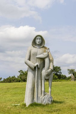 Carnoet, France - June 13, 2025: The valley of the Saints in Quenequillec Carnoet in France. Historic monumental sculpture Saint Eliant.