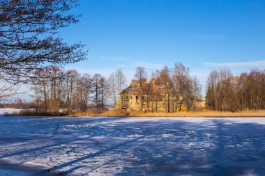 Trakai, Lithuania - 01 08 22: abandoned manor near the lake.
