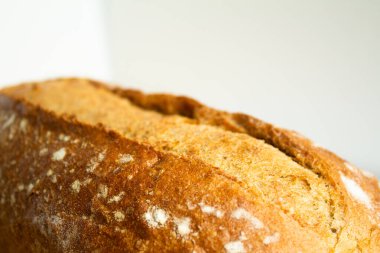 close-up of a cut on whole grain bread - on a white background with a blurred background