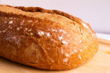 photo of whole grain bread - on a cutting board with white background