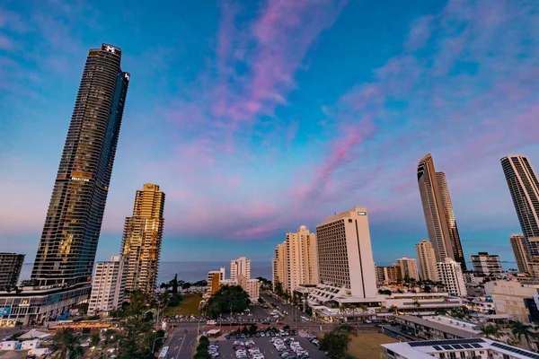 stock image Surfers Paradise QLD Australia - 9 July 2023: Highrise buildings, apartment blocks and upmarket hotels that form the Gold Coast city skyline with vibrant colored sky at sunset