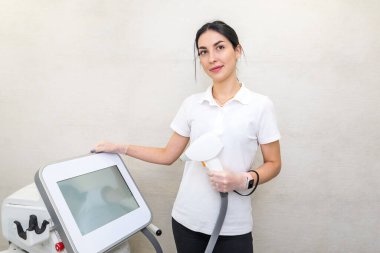 Portrait of a beautiful woman master of laser hair removal in a beauty salon