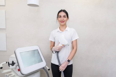 Portrait of a beautiful woman master of laser hair removal in a beauty salon