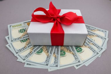 Gift box and dollar bills 