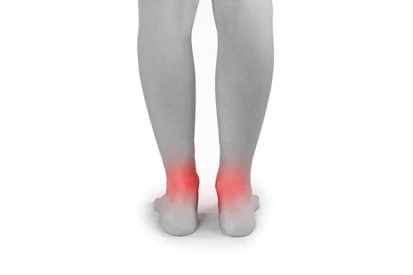 灰色の背景に痛みを伴う足のクローズアップ 赤点付き黒と白の写真 — ストック写真