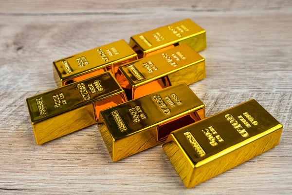 Gold Bars Wooden Table — Stock Photo, Image