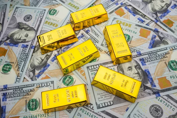 gold bars on dollars. Gold bars on money
