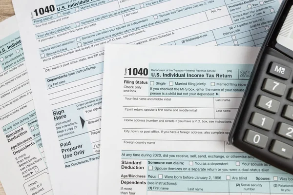 The concept of the deadline for paperwork. Blank tax form. Tax deadline concept.1040 tax forms.financial document