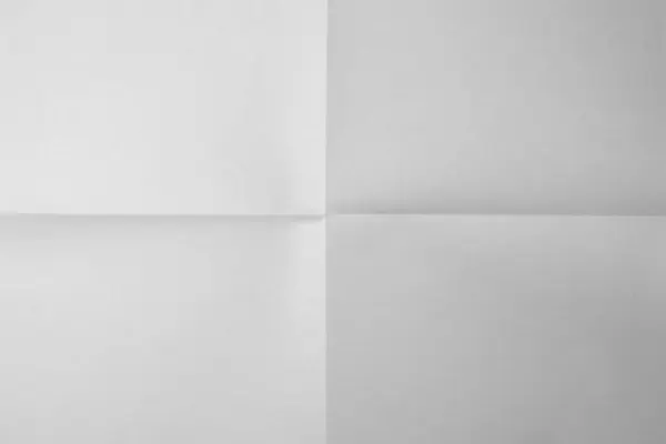 Beyaz Kağıt Katlandı Beyaz Kağıt Dört Bölümün Arka Planına Karşı — Stok fotoğraf