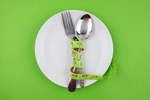 Measuring Tape Plate Cutlery Green Background Concept Diet Weight Loss — Stock Photo, Image