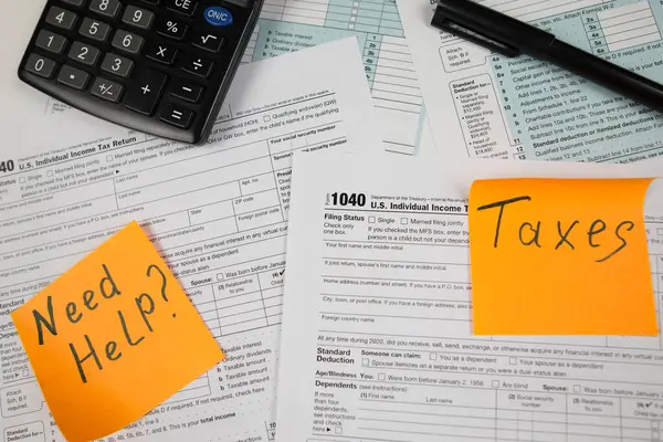 Tax time concept.Tax form with office supplies on white. financial document.Tax Form 1040. April Tax Time.