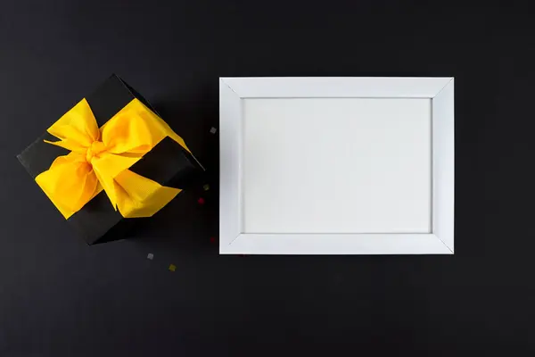 Top View Photo Gift Box Yellow Bow White Wooden Frame — Stock Photo, Image
