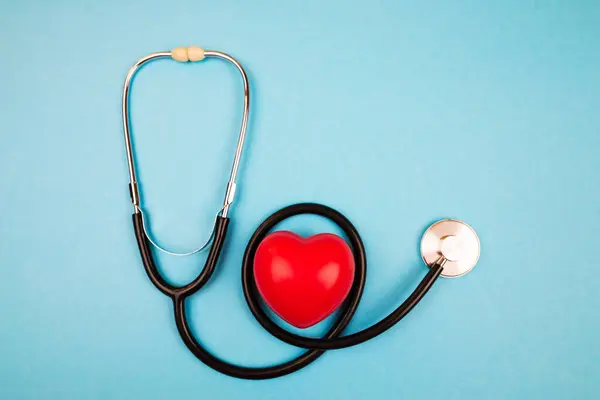 stock image stethoscope and heart on blue background