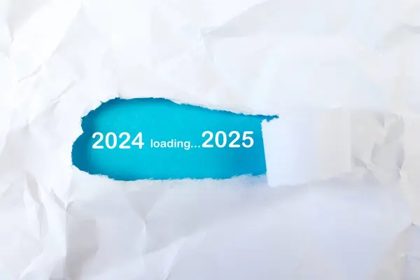 stock image Loading 2025 symbol on torn paper. New year 2025 coming concept.