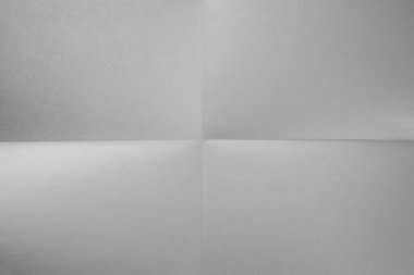 Beyaz kağıt katlandı. Beyaz kağıt dört bölümün arka planına karşı katlanır