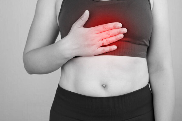 Abdominal pain, pain in stomach area, symptoms of gastritis or pancreatitis, woman with abdominal pain, painful area highlighted in re