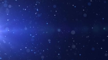 Mavi bokeh parçacıkları, toz gradyan soyut arkaplanı ödüllendirir. Mavi arkaplanda uzayda fütürist ışıltı.