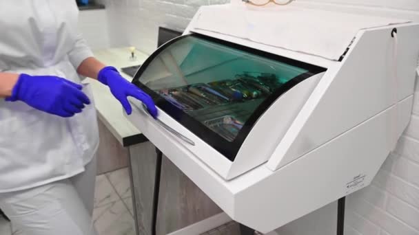 Close Dental Assistant Doctor Dentist Hygienist Opening Ultraviolet Autoclave Sterilizer — Video