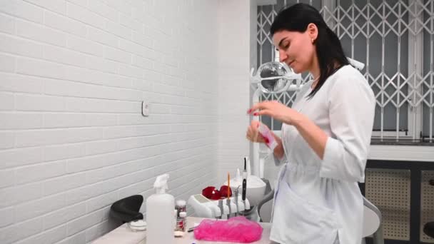 Side Portrait Caucasian Confident Female Dentist Doctor Puts Medical Mask — Stock Video
