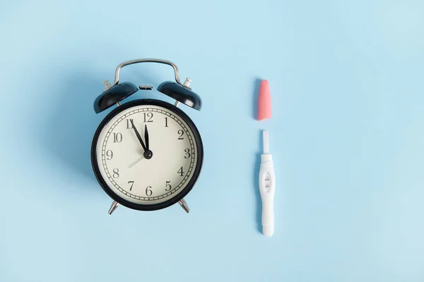 Still Life Alarm Clock Positive Inkjet Pregnancy Test Kit Showing — Stock Photo, Image