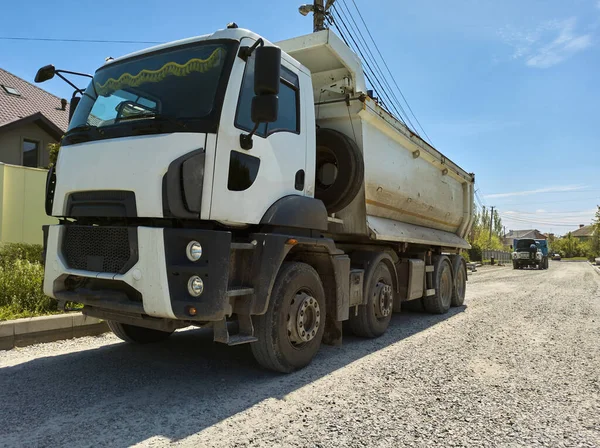 stock image Still life with a truck carrying construction sand or concrete. The concept of reloading on the roads and renting a dump truck for work, road repair. Copy advertising space.