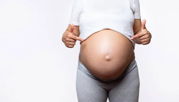Closeup Advertising Studio Shot Pregnant Woman Pointing Index Fingers Her — Stock Photo, Image