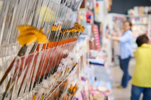 stock image Selective focus. Group of paintbrushes with natural and synthetic bristle of different softness, displayed for sale in creative art shop. Painting. School stationery store. Drawing. Creativity. Hobby