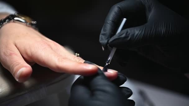 Close Manicurist Hands Black Protective Gloves Applying Layer Clear Transparent — Stock Video