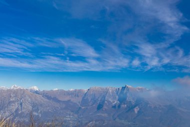 Clouds in the sky over mount matajur, friuli venezia-giulia, italy clipart