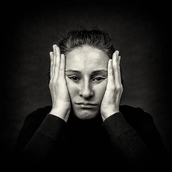 Conceptual Dark Portrait Unhappy Woman Hands Her Head Stretching Face 免版税图库图片