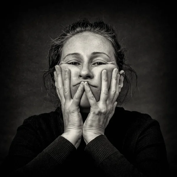 Conceptual Dark Portrait Old Tired Woman Stretching Skin Her Face 图库图片