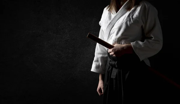 Woman Black Hakama Standing Fighting Pose Wooden Sword Bokken Grunge 图库图片