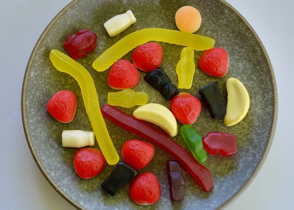 Chewy jelly candies on a plate in the kitchen