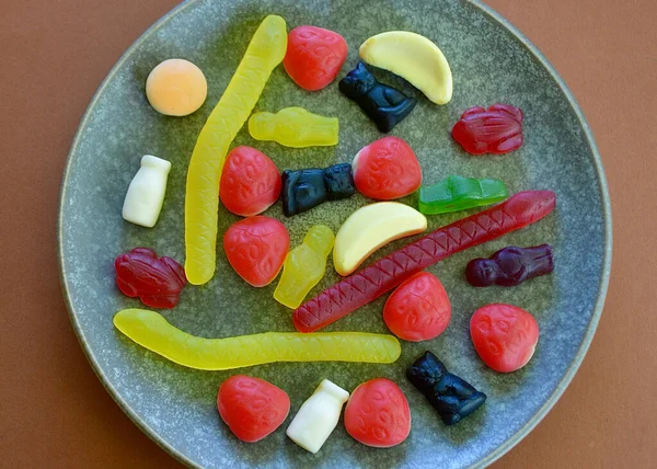Chewy jelly candies on a plate in the kitchen