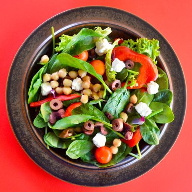 A Greek salad on a plate  - top view.  clipart