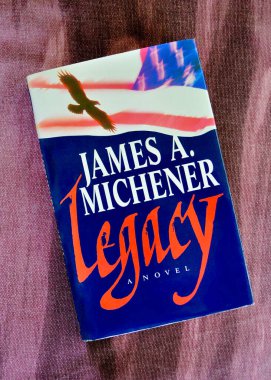 Sydney, Australia. January 2025. A closeup of a well read book cover of Legacy by novelist James A Michener.  clipart