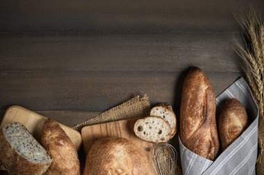 slide multi grain sourdough bread and sliced Baguette on wood background, Homemade bakery concept