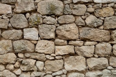 taş gülümsemek güneşli da duvar.