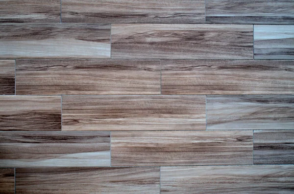 stock image Light cladding tiles imitating wood on wall closeu