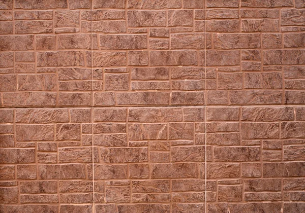 stock image Light brown cladding tiles imitating stone on wall closeu