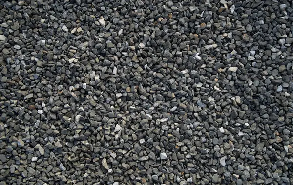 Small black gravel on road close u