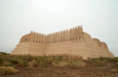 Partially restored ancient adobe fortress Kyzylkala in desert Kyzyl Kum in Uzbekistan, Asi clipart