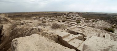 Panorama of partially restored ancient adobe fortress Toprak Kala in desert Kyzyl Kum in Uzbekistan, Asi clipart